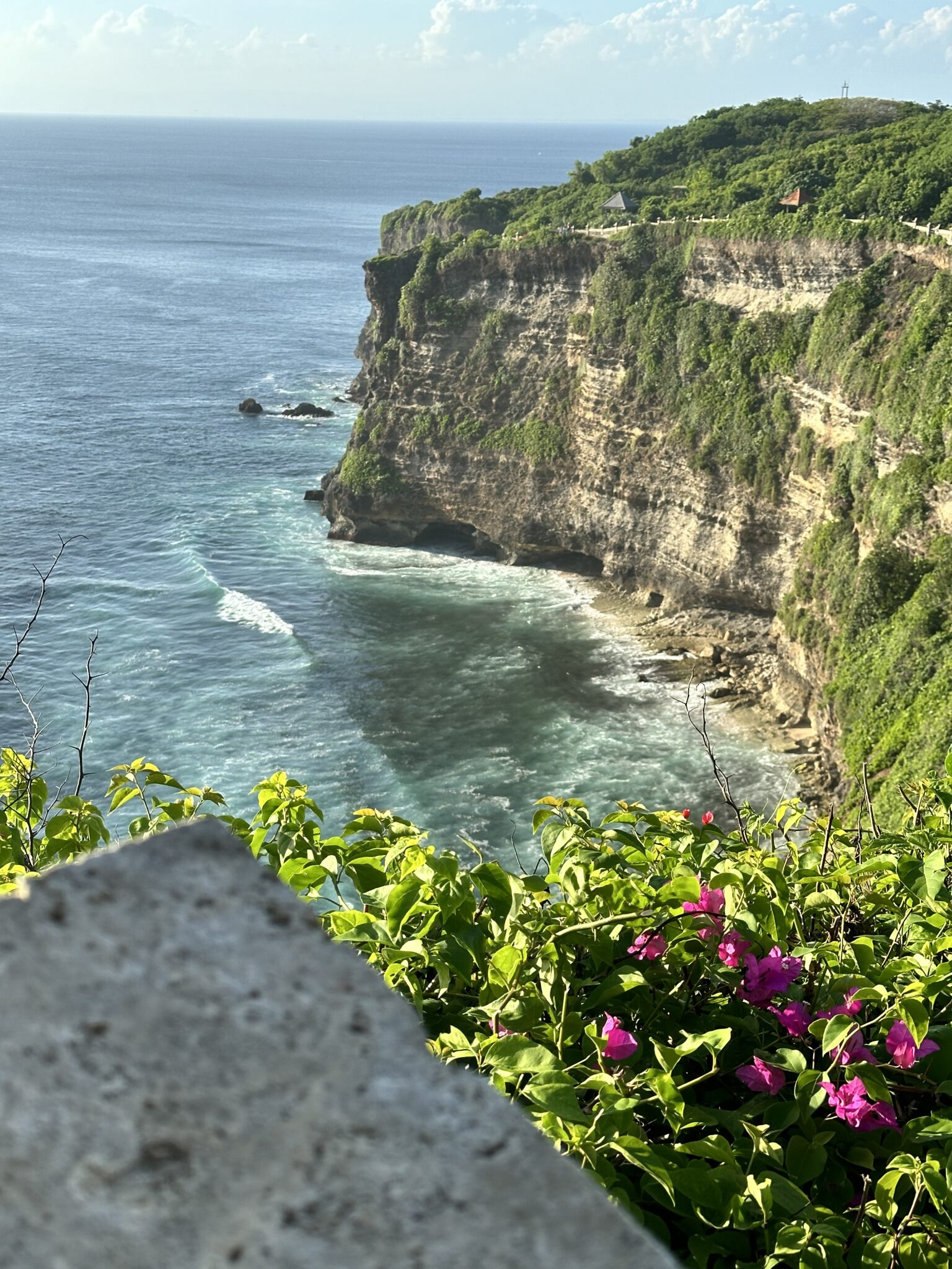 Uluwatu Temple perched on cliffs, overlooking the ocean