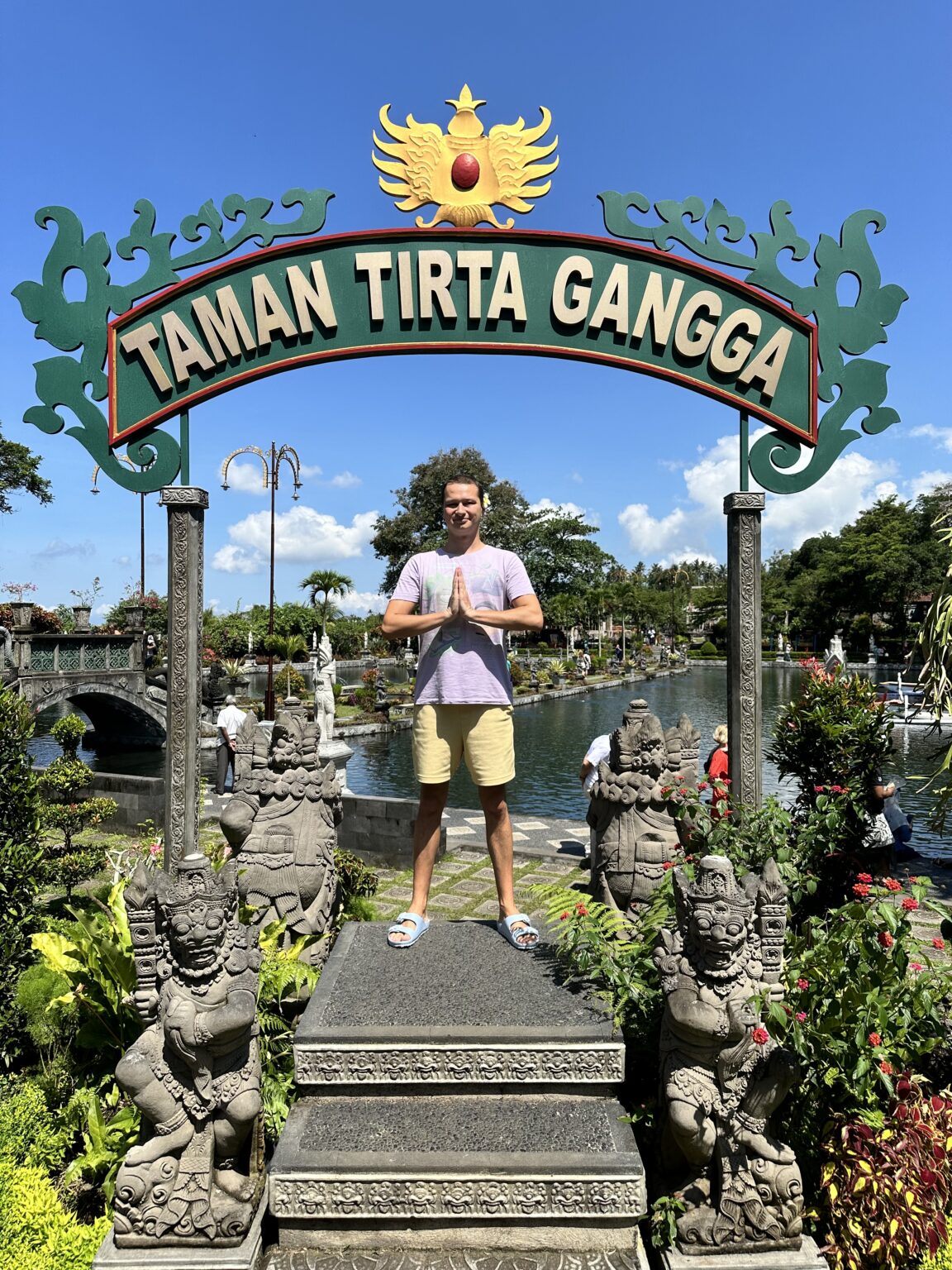 The serene water palace of Tirta Gangga with koi fish swimming below