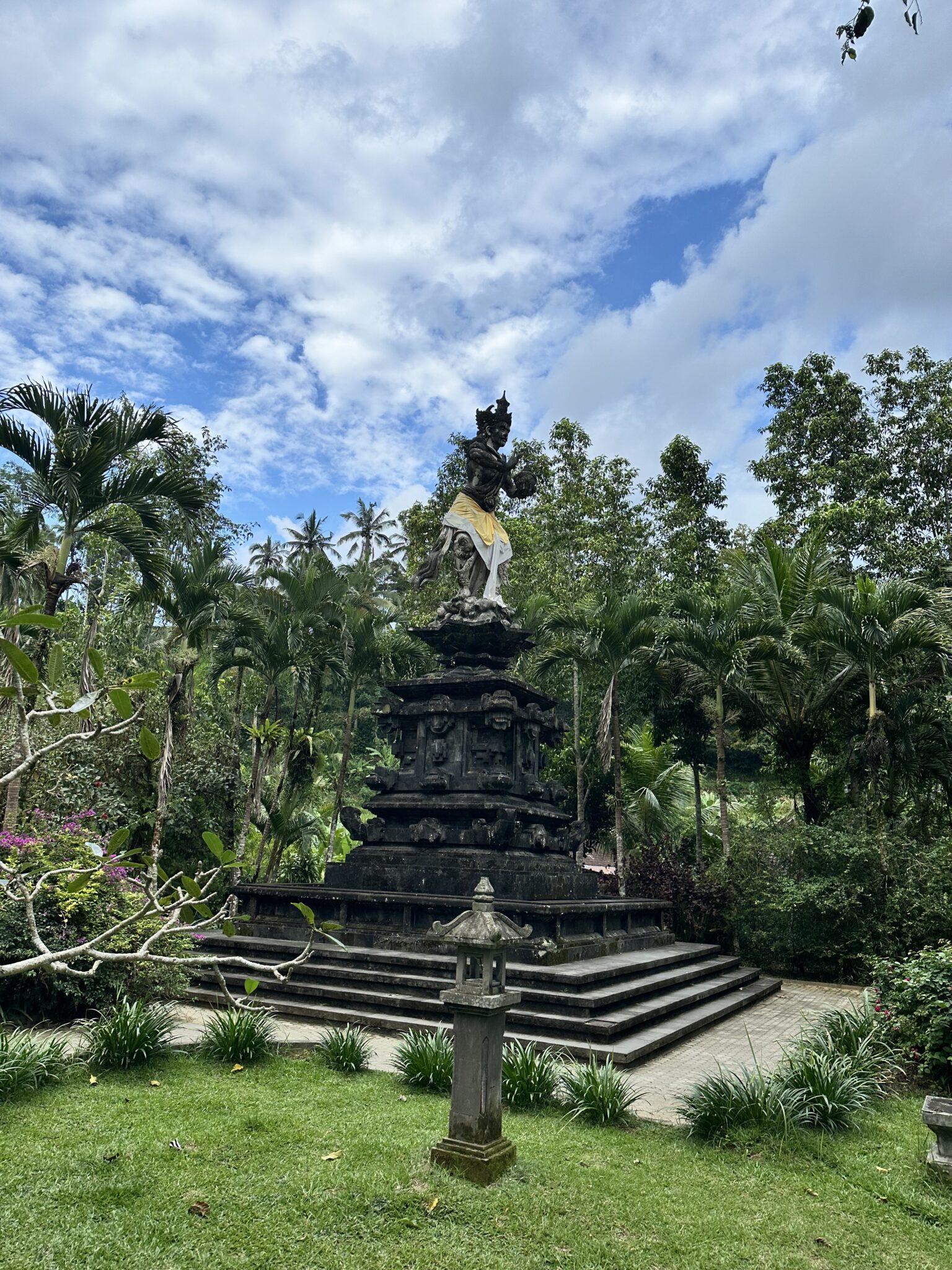 A sacred Balinese statue, draped in traditional fabric
