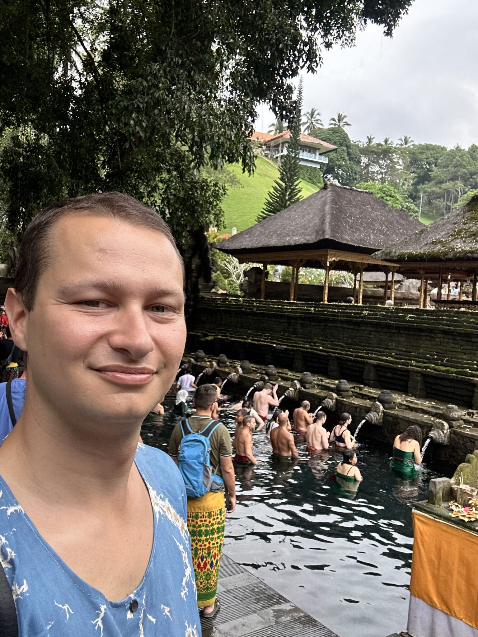 Balinese locals and tourists in the sacred waters of Tirta Empul
